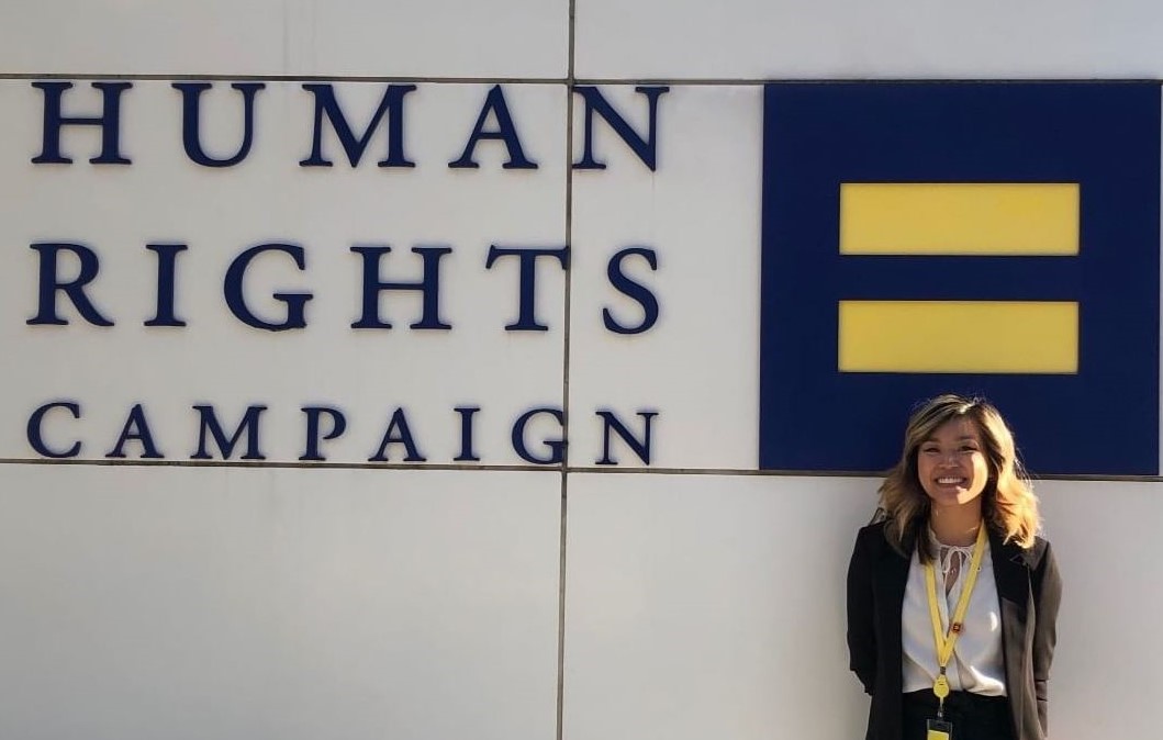 student in front of Human Rights Campaign building